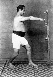 Choki Motobu demonstrates Ippon Ken on the makiwara.